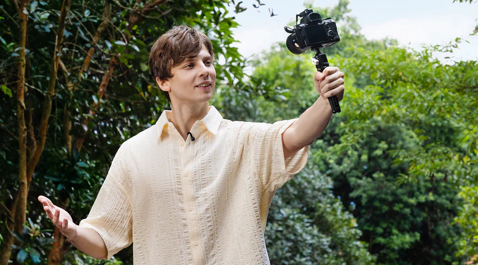 Hollyland Lark M2S Ultimate Combo wireless microphone system with camera, USB-C, and Lightning connectors in use.