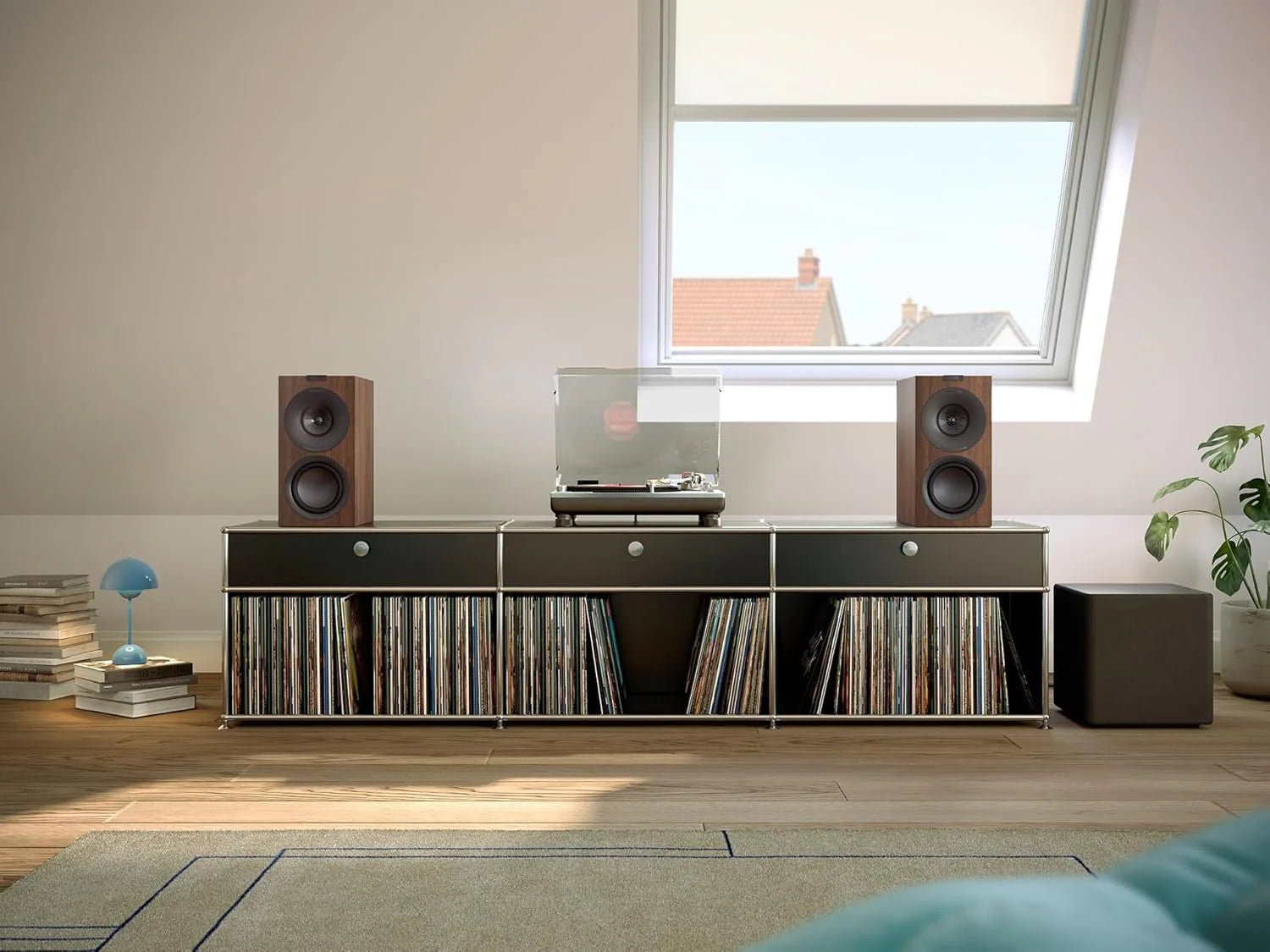 KEF Q Concerto Meta passive bookshelf speakers with sleek black finish and compact design, suitable for high-quality home audio.