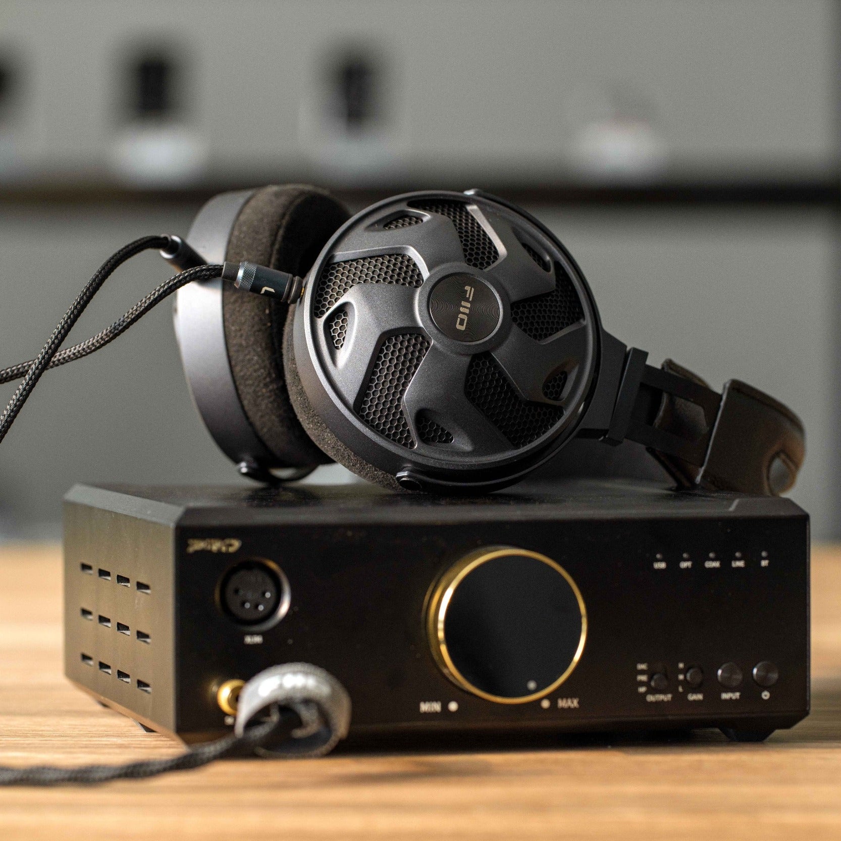 FiiO FT3 wired headphones with 32 ohm impedance, black over-ear design, and cushioned ear cups for comfortable listening.