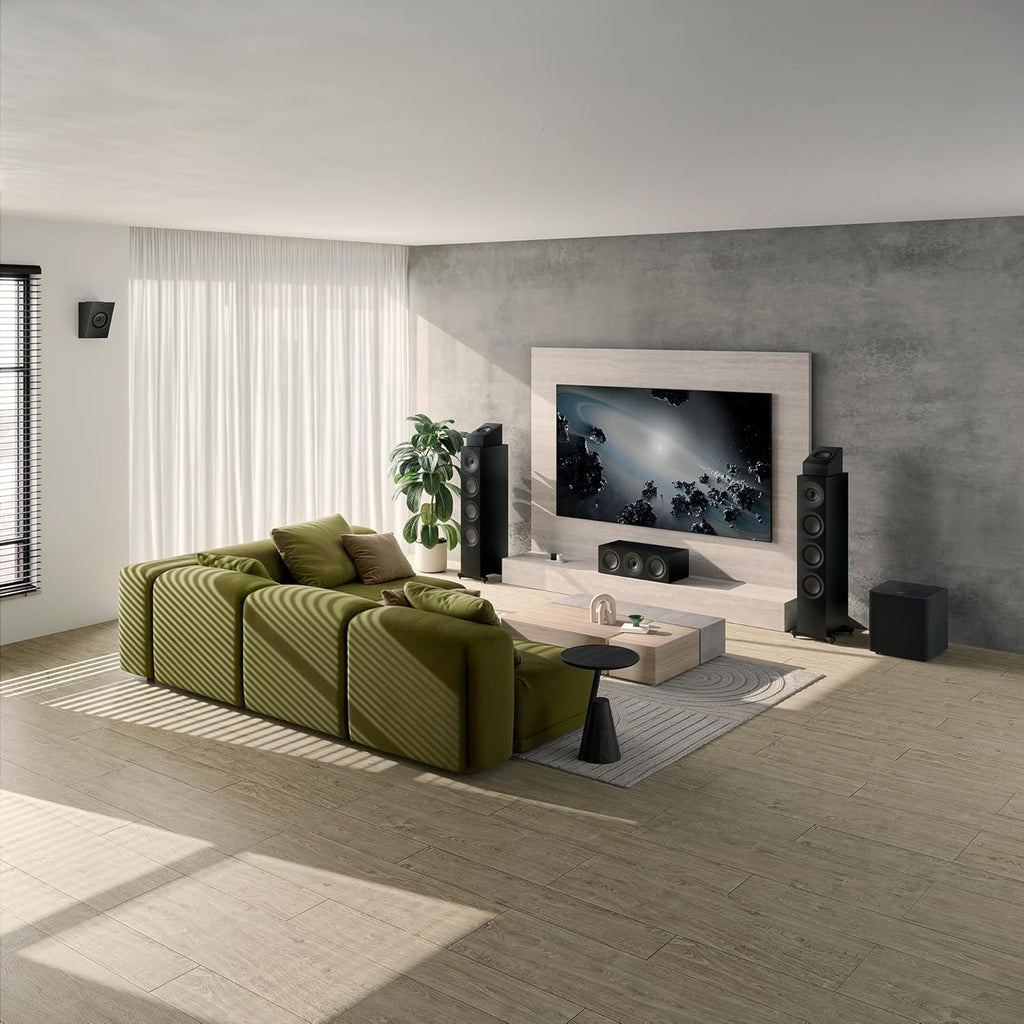 KEF Q6 Meta center speaker showing a sleek black speaker with a circular driver and modern design for home theater audio.