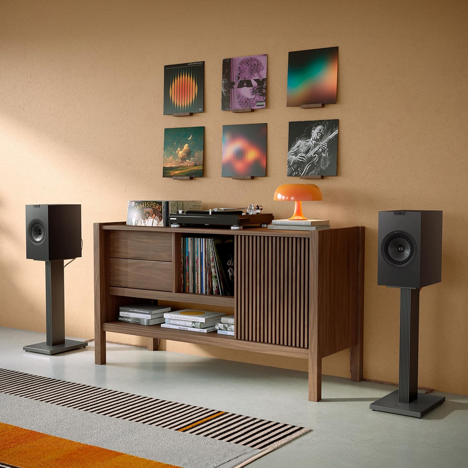 KEF Q3 Meta passive bookshelf speakers with sleek black finish and compact design for high-quality audio.