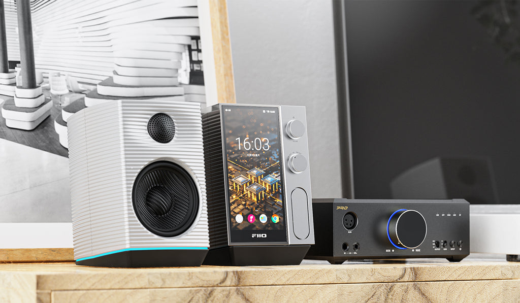 FiiO R9 music streamer with sleek black design, multiple ports, and digital display for high-quality audio streaming.