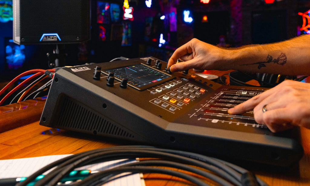 Alto Professional TMD16 digital mixer with multiple input channels, knobs, and controls for live sound and recording setups.