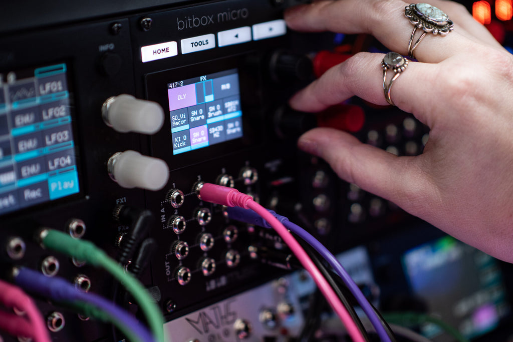 Black 1010music Bitbox Micro semi-modular synthesizer with knobs and controls for creating electronic music.