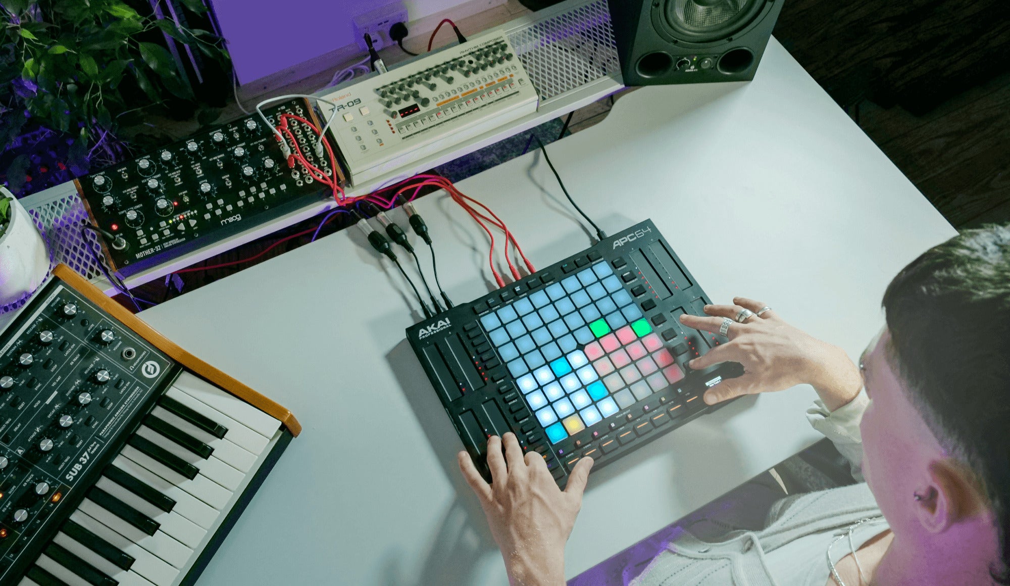 Akai Professional APC64 MIDI controller with 64 pads and control knobs, designed for music production and live performance.