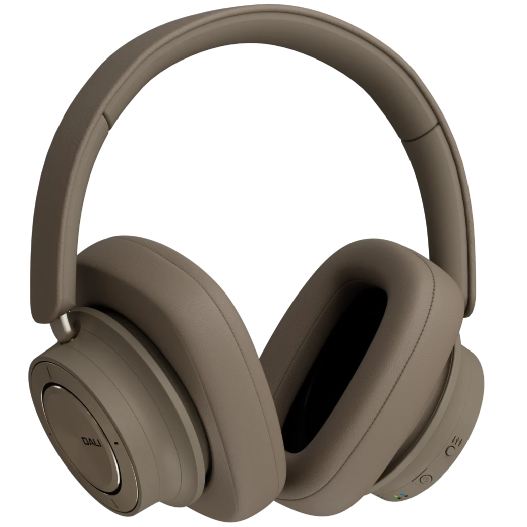 DALI iO-12 wireless headphones in mocha grey with cushioned ear cups and sleek design, resting on a white background.