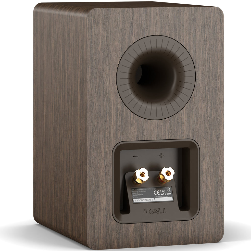 DALI Kupid passive bookshelf speakers with dark walnut finish and grille, showcasing sleek modern design.