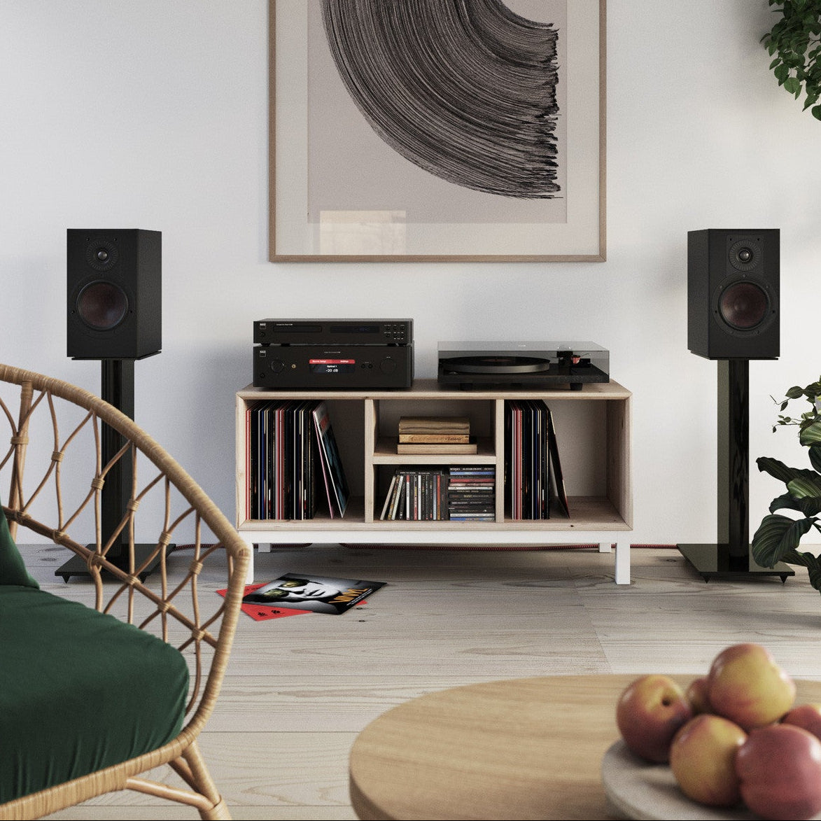 Black DALI Opticon 2 MK2 passive bookshelf speakers with sleek design and wood finish, showing the front grille and speaker cones.