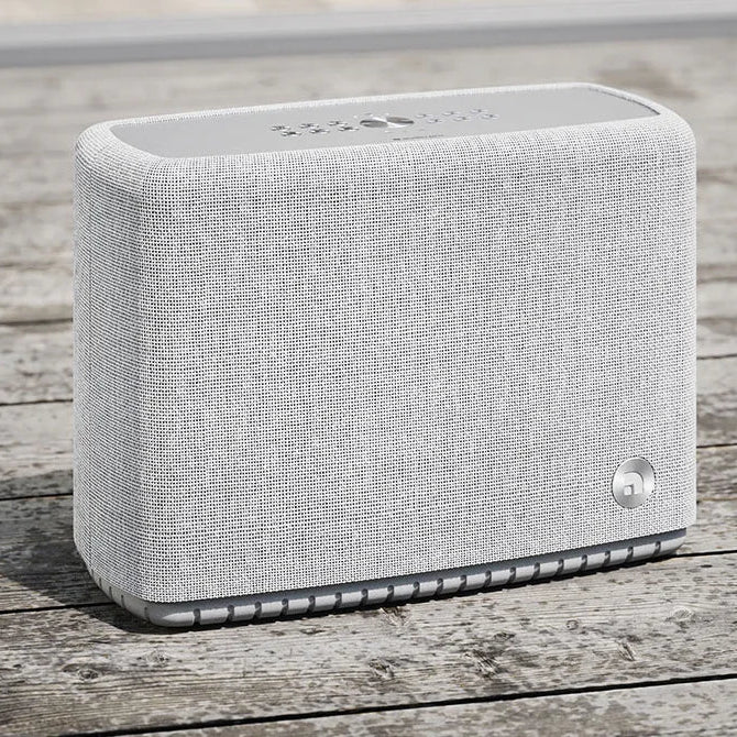Audio Pro A15 portable speaker in black with a compact design and control buttons on top, ideal for versatile sound on the go.