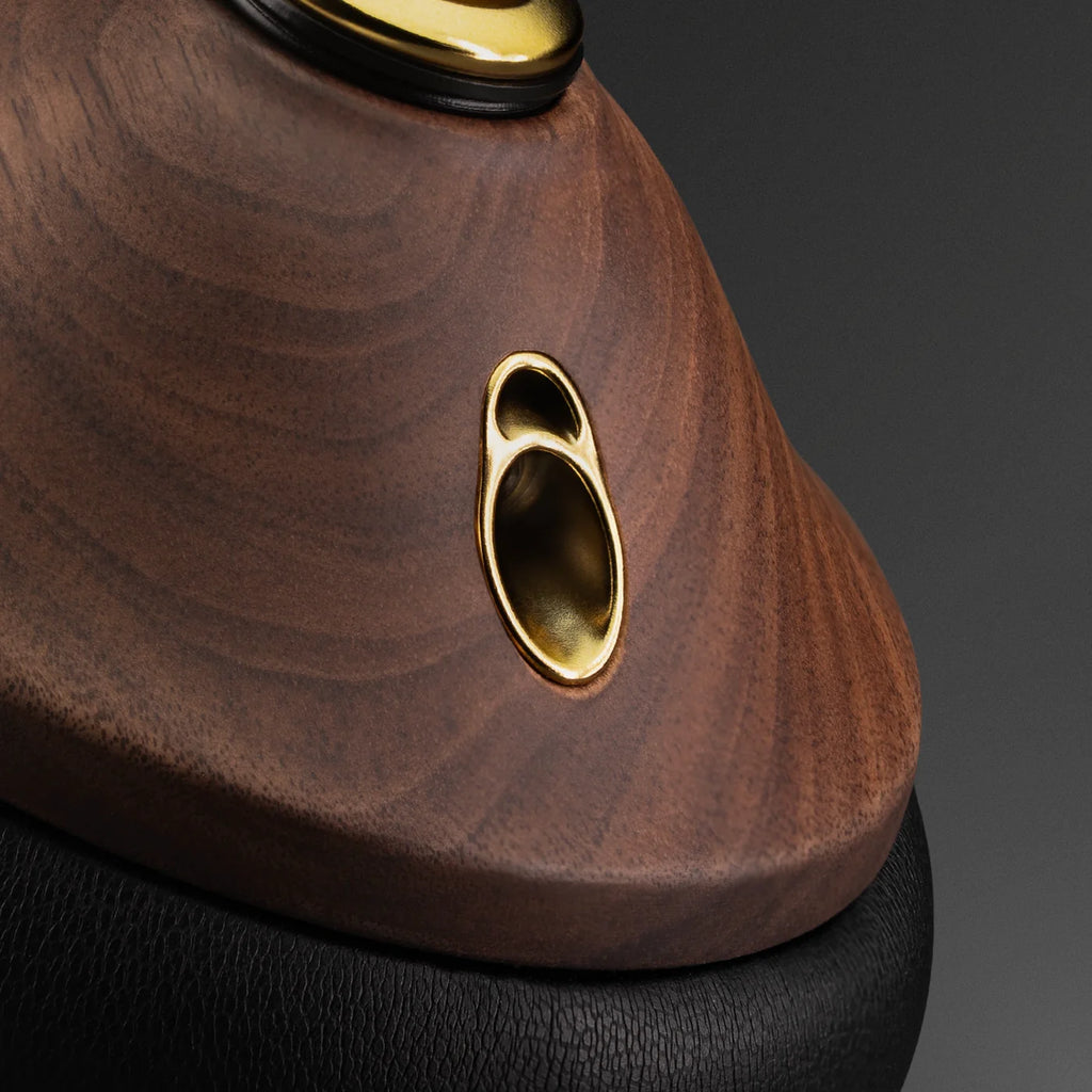 Close-up of Meze Audio 99 Classics 2nd Gen wired headphones showing ear cups and input socket for premium sound.
