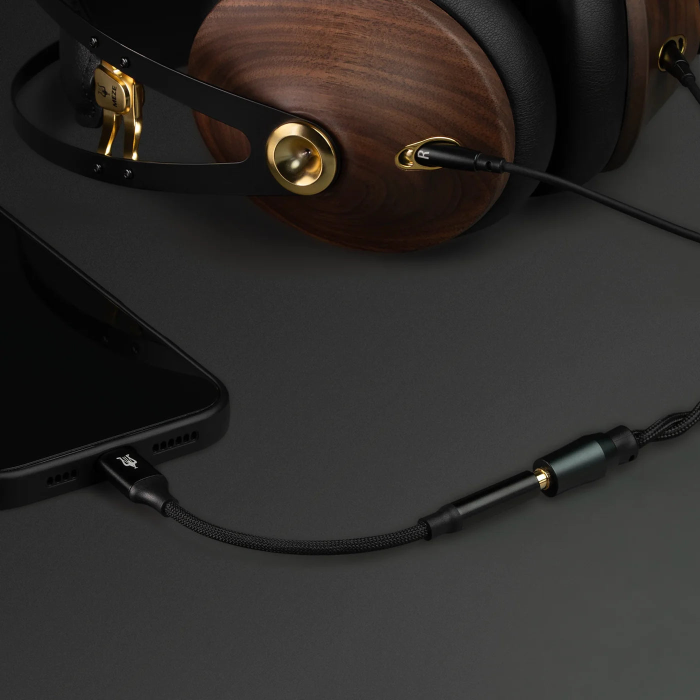 Close-up of Meze Audio 99 Classics 2nd Gen wired headphones with wooden ear cups and black headband, showcasing modern design.
