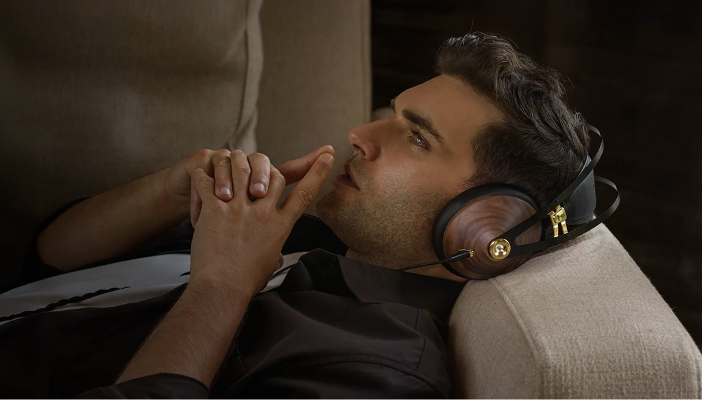 Meze Audio 99 Classics 2nd Gen wired headphones with wooden ear cups and black headband, close-up view of the stylish design