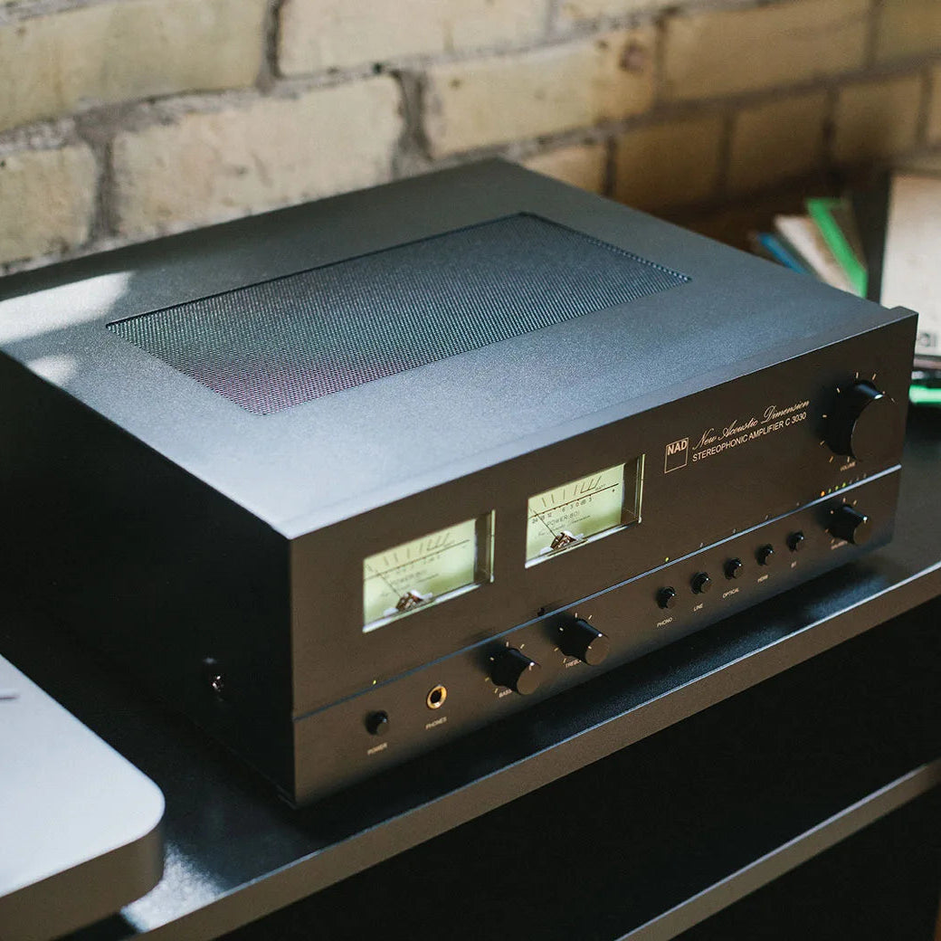 NAD C 3030 stereo amplifier with sleek black design, front panel controls, and digital display for high-quality audio performance.