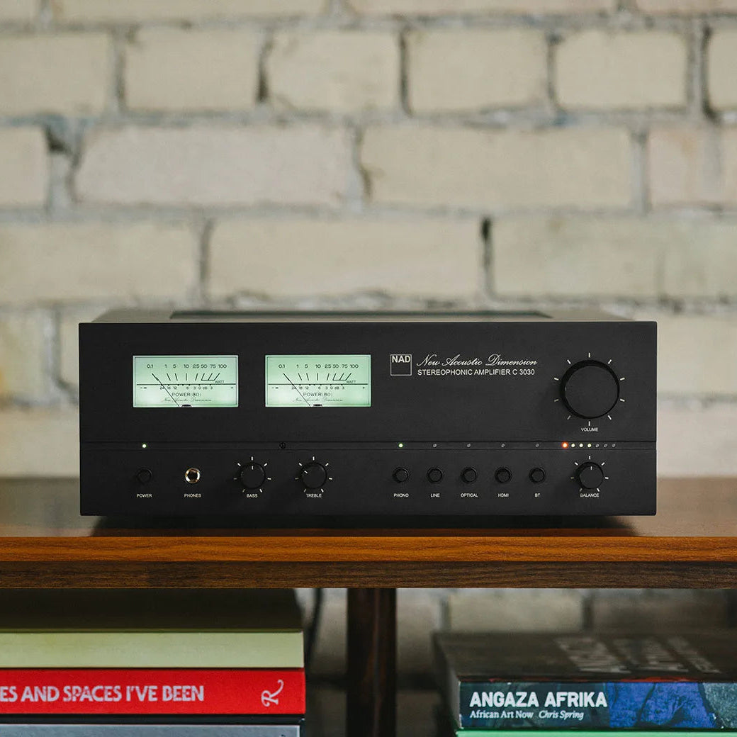 NAD C 3030 stereo amplifier with sleek black design and control knobs, showcasing high-quality audio equipment for home audio systems.