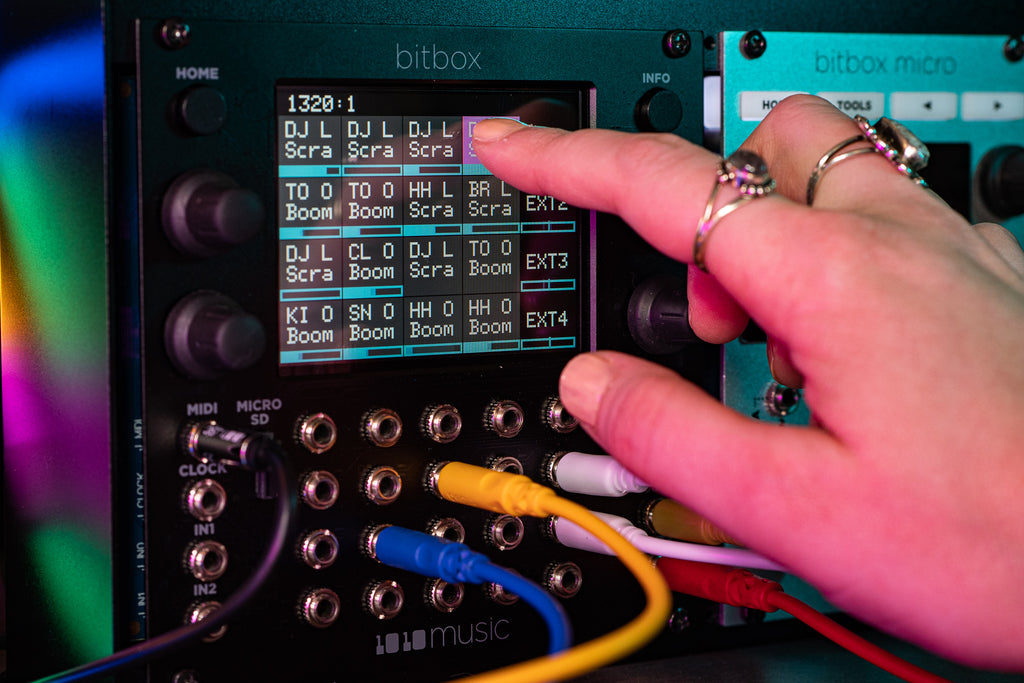 1010music Bitbox MK2 semi-modular synthesizer with knobs, buttons, and LED display for electronic music production.