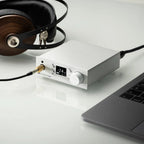 Pro-Ject Pre Box S2 Digital Edition 23 headphone amplifier and DAC with sleek black design and various input ports.