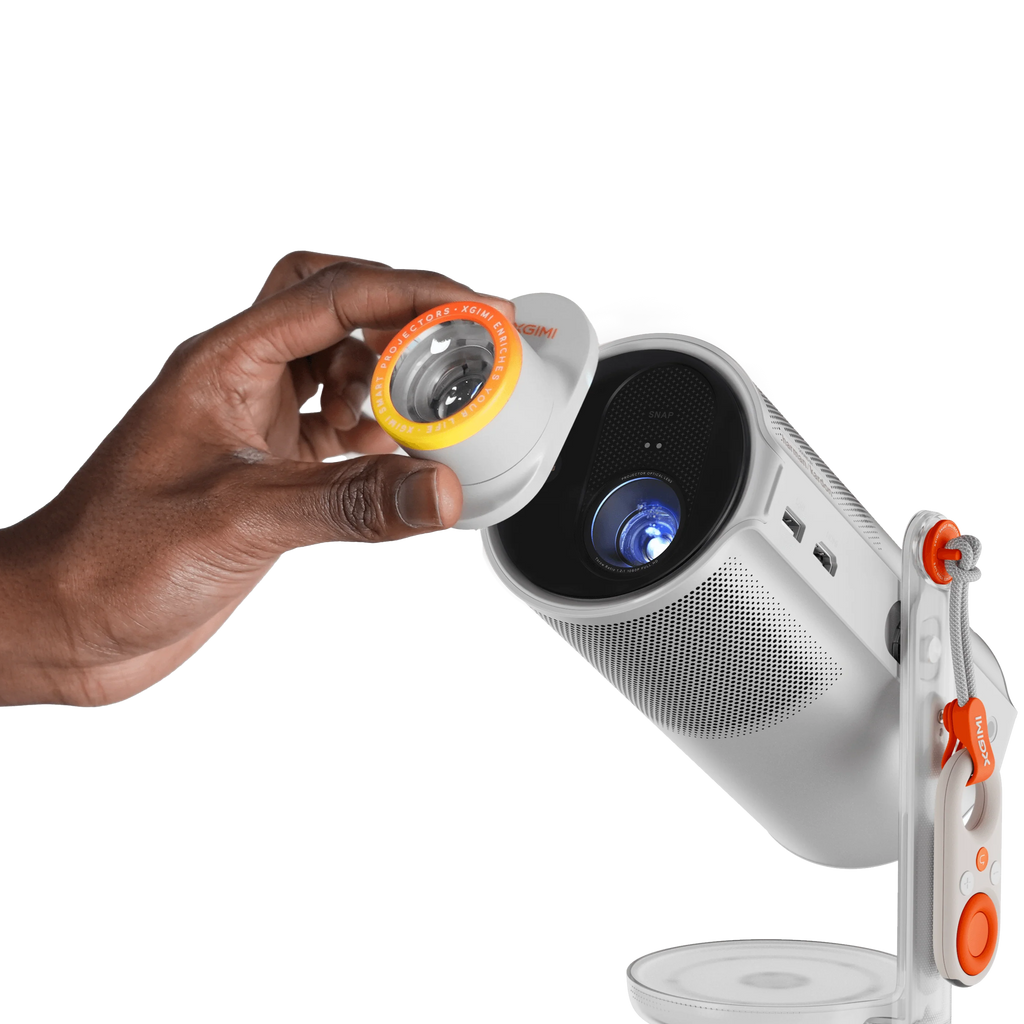 Xgimi Mogo 4 portable projector displaying colorful image on wall, compact design with built-in lens and ventilation.