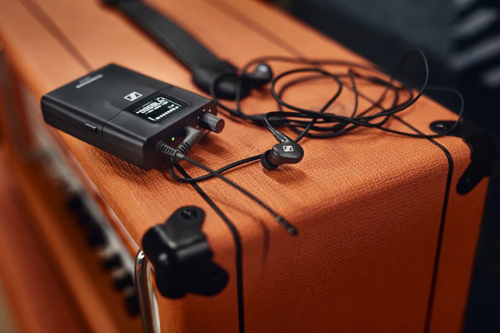 Sennheiser XSW IEM Set wireless microphone system with receiver and transmitter units on a white background.