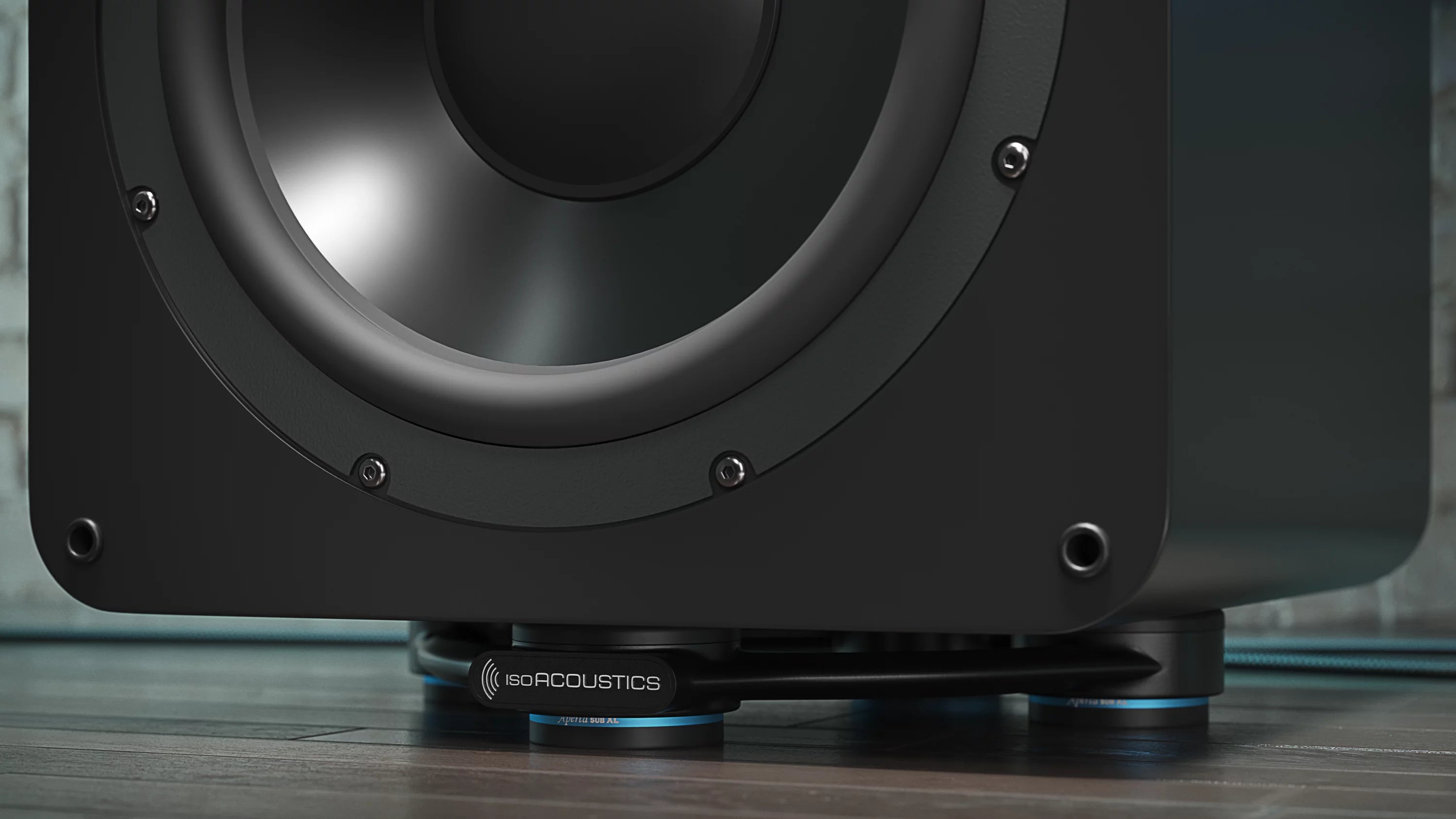 IsoAcoustics Aperta SUB XL speaker stands supporting a subwoofer with a sleek black design and sturdy build.