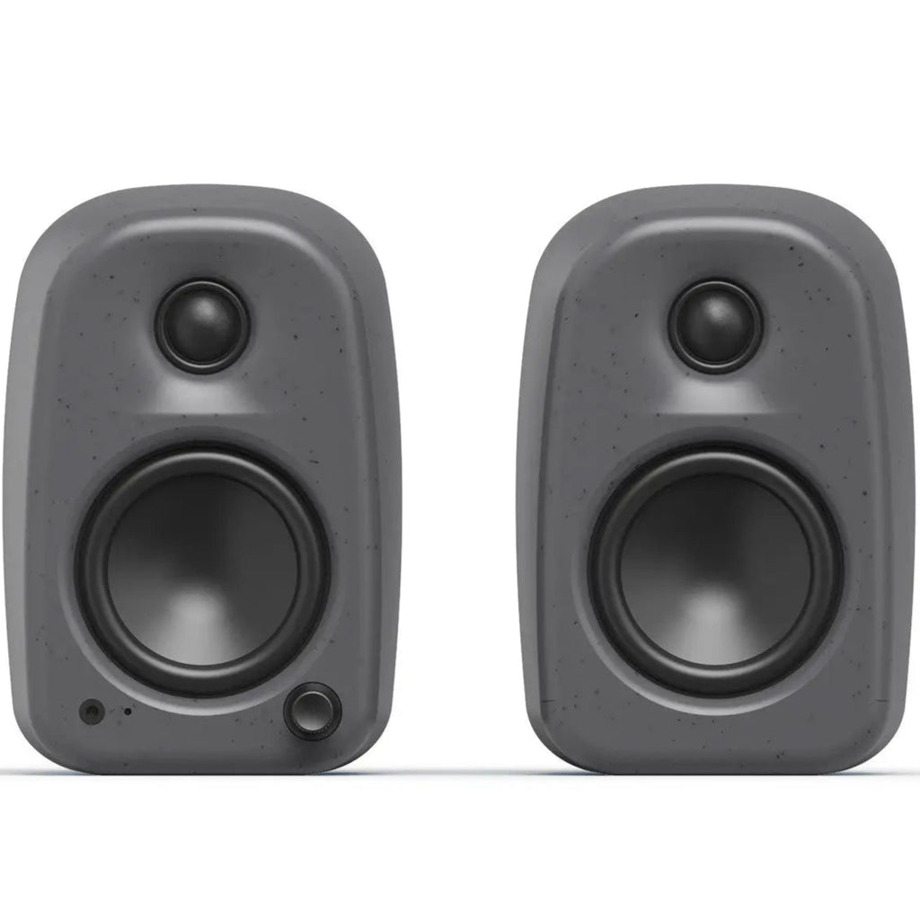Kanto Audio UKI desktop speakers shown from the front, with a sleek black design and compact rectangular shape.