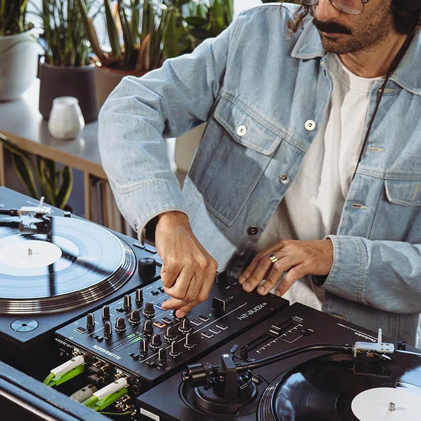 Allen & Heath Xone:24 DJ mixer with multiple knobs and faders, professional audio equipment for DJs and mixing setups.