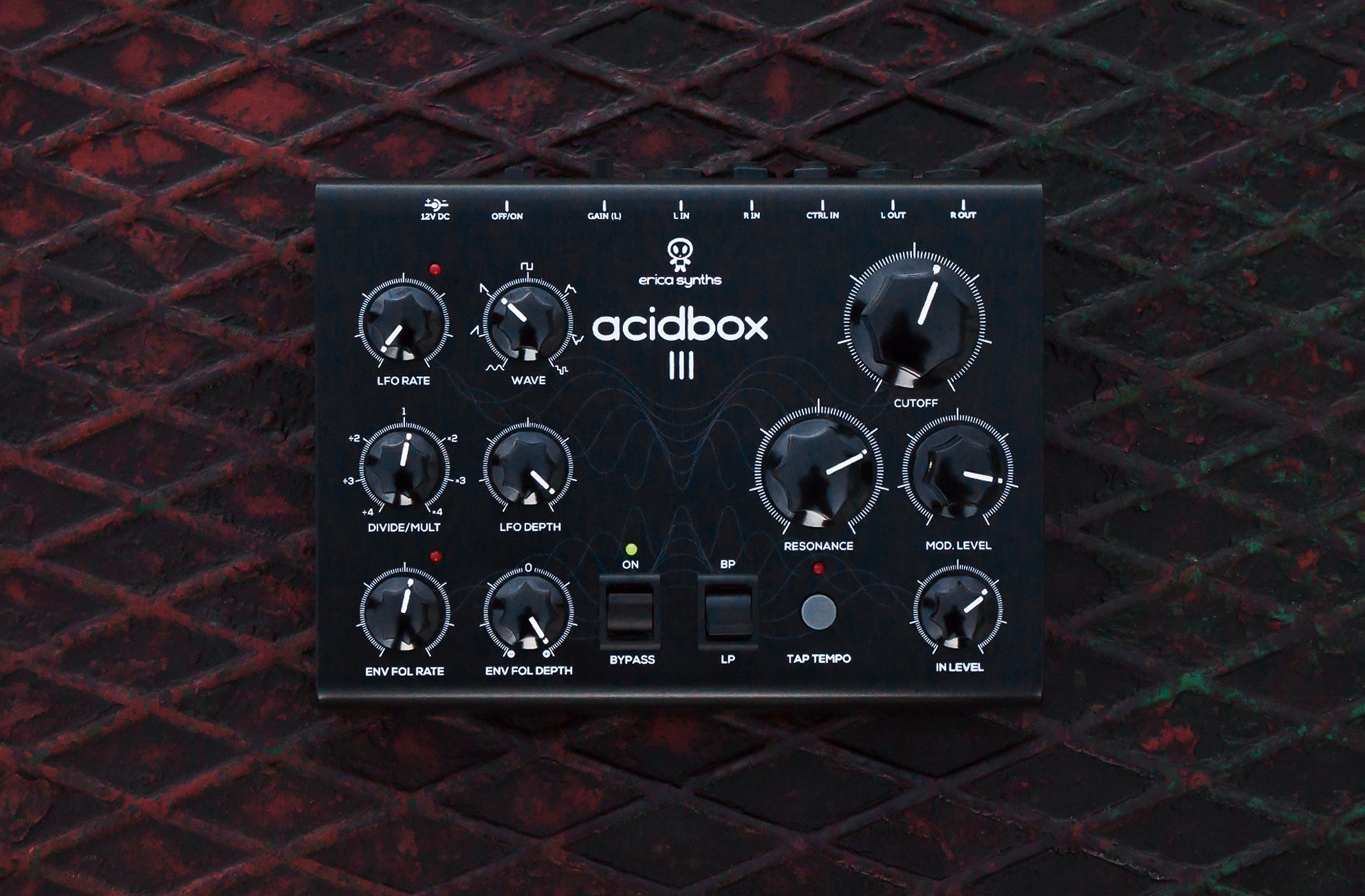Erica Synths Acidbox III effect pedal with multiple control knobs and input/output jacks, used for acid sound effects.
