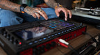 Akai Professional MPC Live III drum machine and sampler with touchscreen interface and portable design.