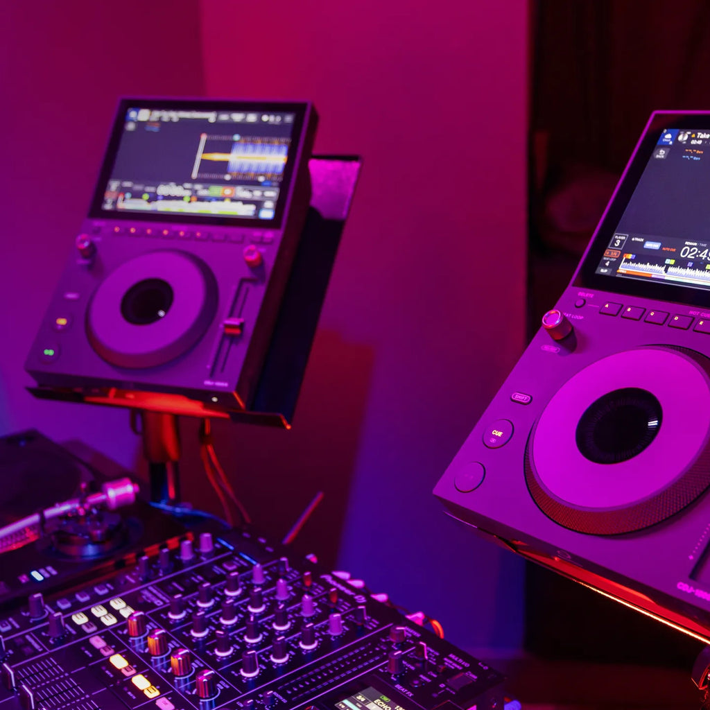 AlphaTheta CDJ-1500X players in a club DJ booth