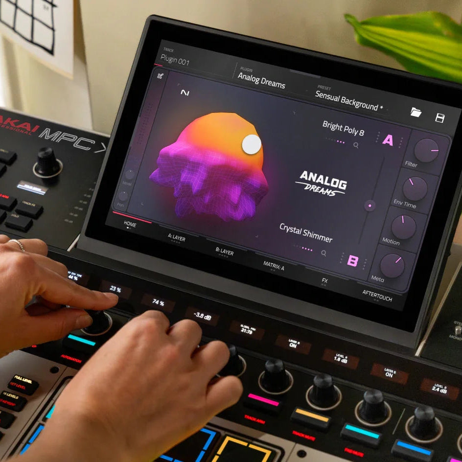 Akai Professional MPC XL drum machine and sampler with large pads, display screen, and control knobs for music production.
