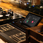 Akai Professional MPC XL drum machine and sampler with large grid of pads, control knobs, and screen for music production.