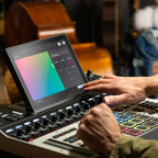 Akai Professional MPC XL drum machine and sampler with large pad interface and control knobs, black and silver design.