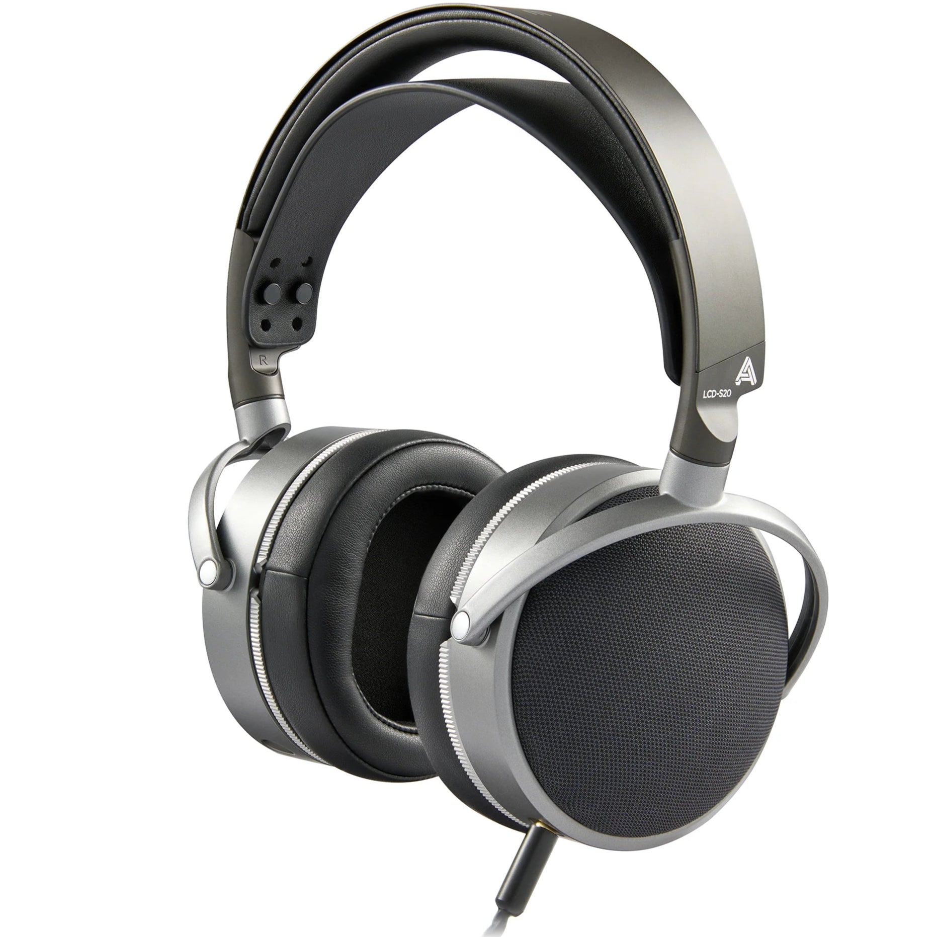 Audeze LCD-S20 closed-back planar studio headphones with over-ear design and sleek black finish, positioned on a surface.