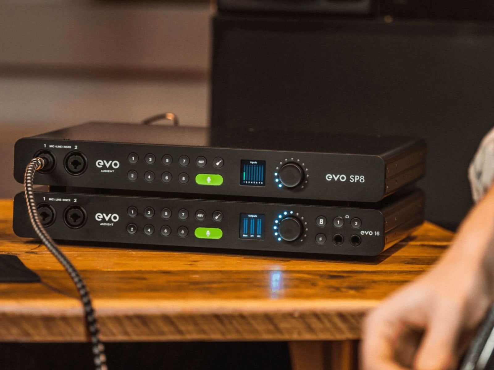 Audient EVO SP8 microphone preamp device with multiple input channels and control knobs on a black audio equipment rack.