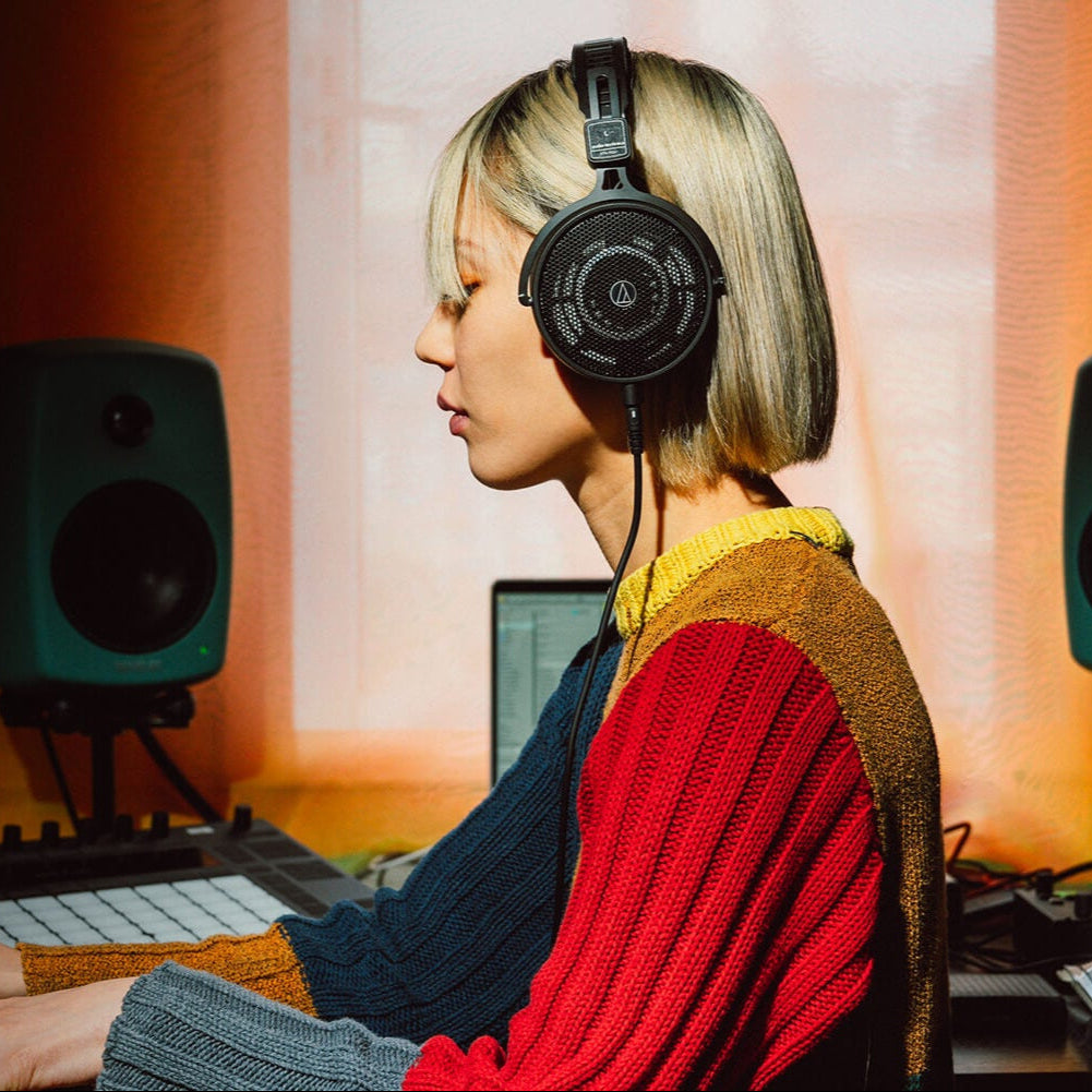 Audio-Technica ATH-R50x open-back studio headphones, top view, in use