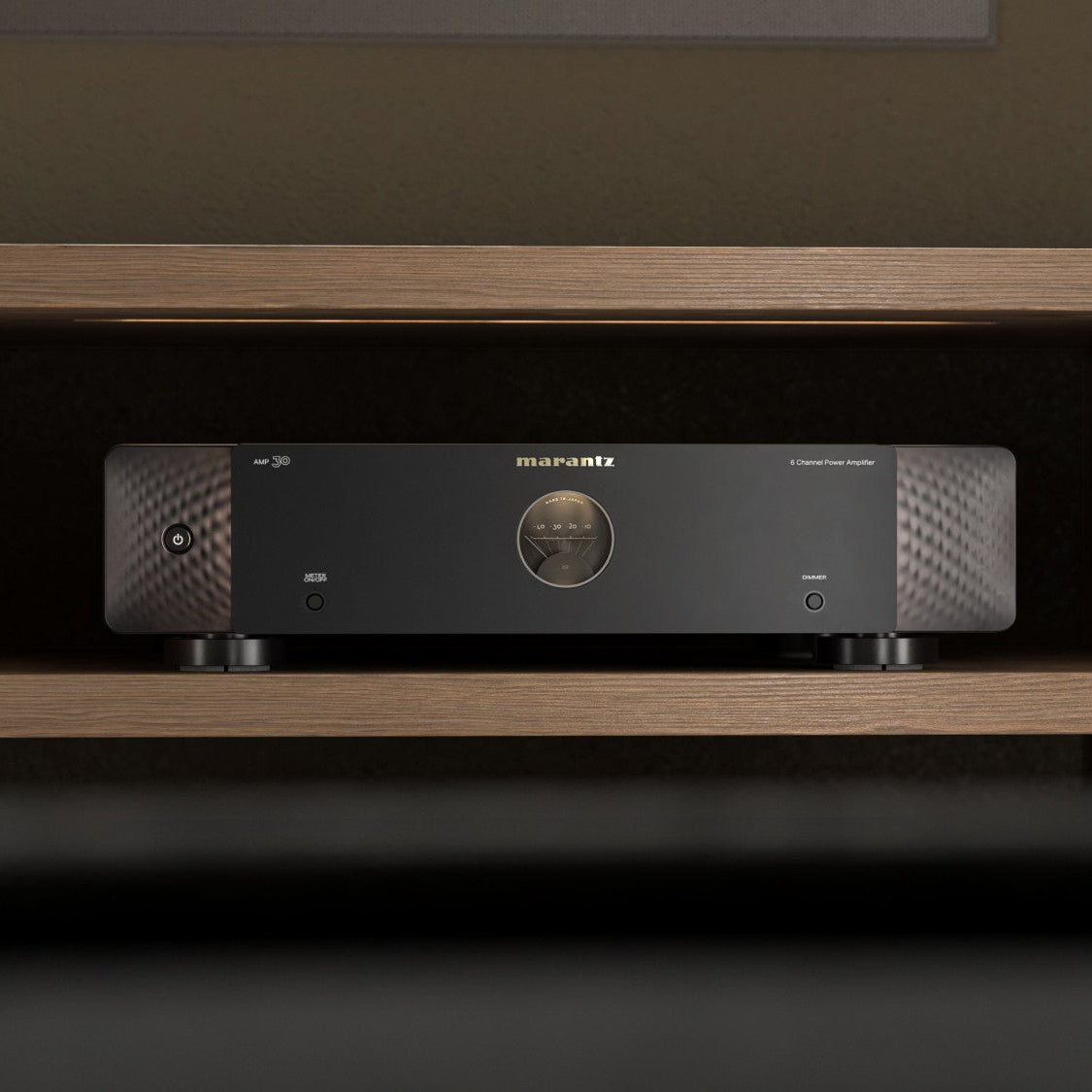 Marantz AMP 30 stereo amplifier with six channels, sleek black design, and control knobs, ideal for high-quality audio setup.