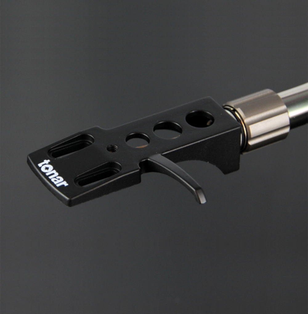 Tonar DJ Headshell for turntable cartridges, showing the lightweight metal design and connection pins for DJ and audiophile setups.