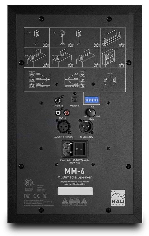 Kali Audio MM-6 active nearfield monitors with rear ports and control panels, shown from the back in a studio setup.