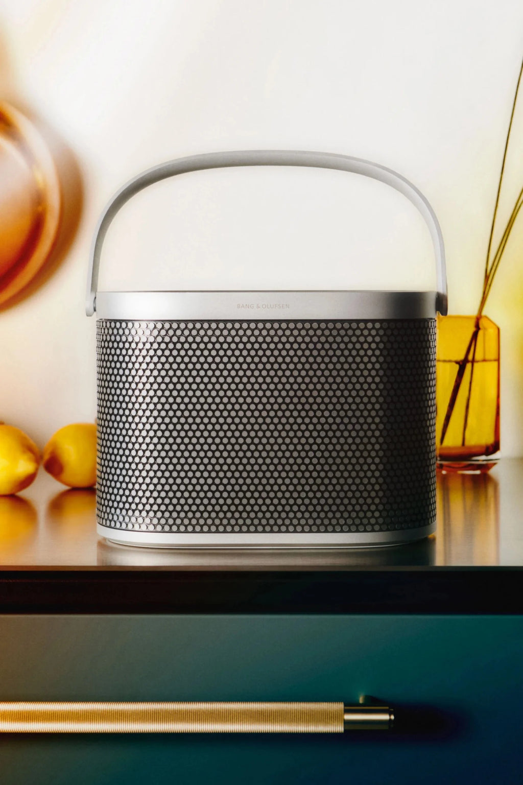 Bang & Olufsen Beosound A5 portable speaker in a sleek design, shown in a moodboard image highlighting its modern aesthetic.