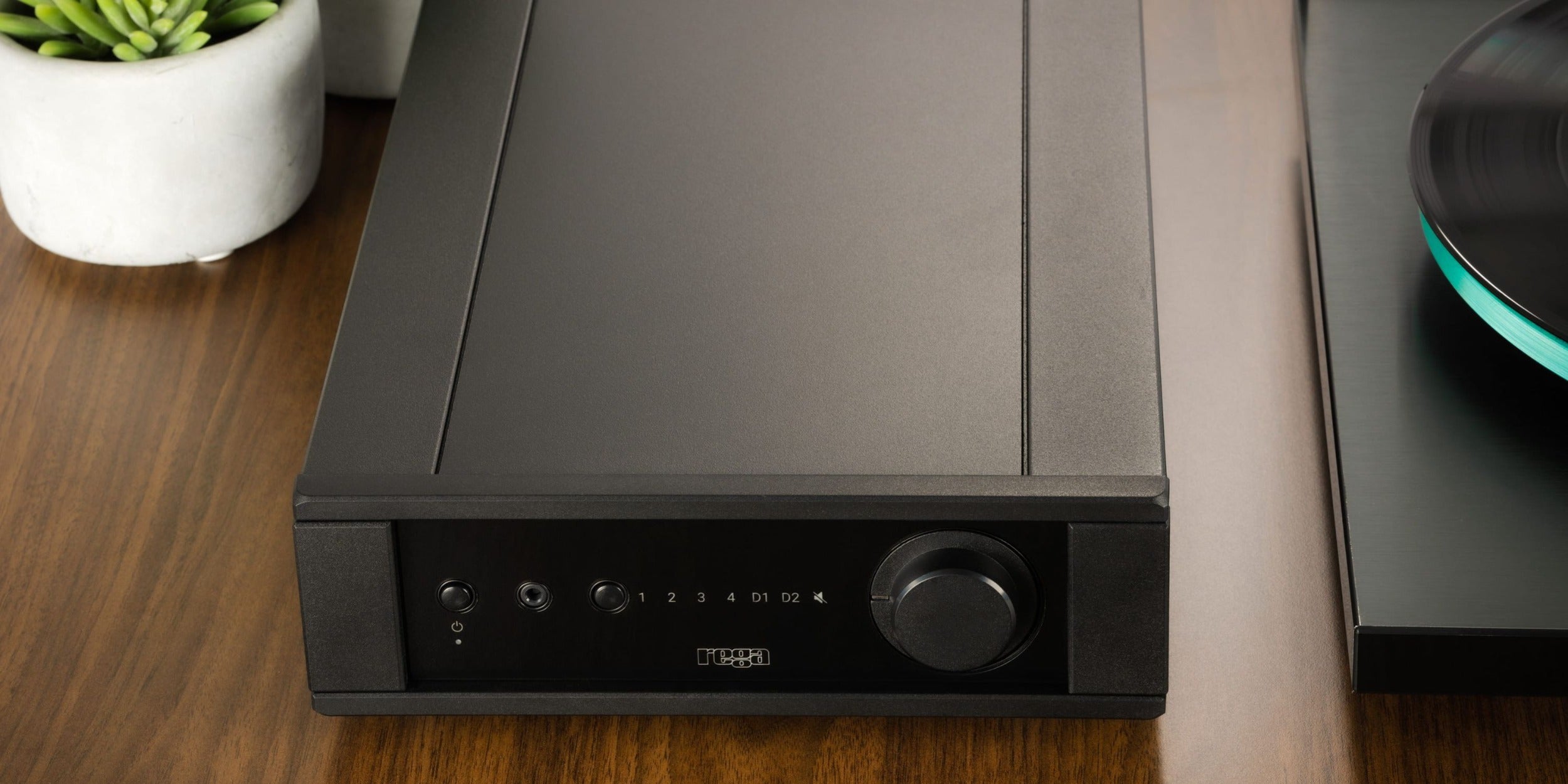 Rega Brio MK7 phono preamp with sleek design and control knobs, showcasing high-quality audio equipment for vinyl enthusiasts.