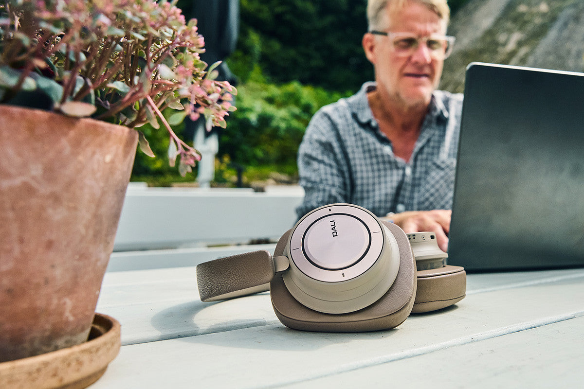 DALI Dali iO-12 wireless Bluetooth headphones in mocha grey with over-ear design and soft ear cushions.