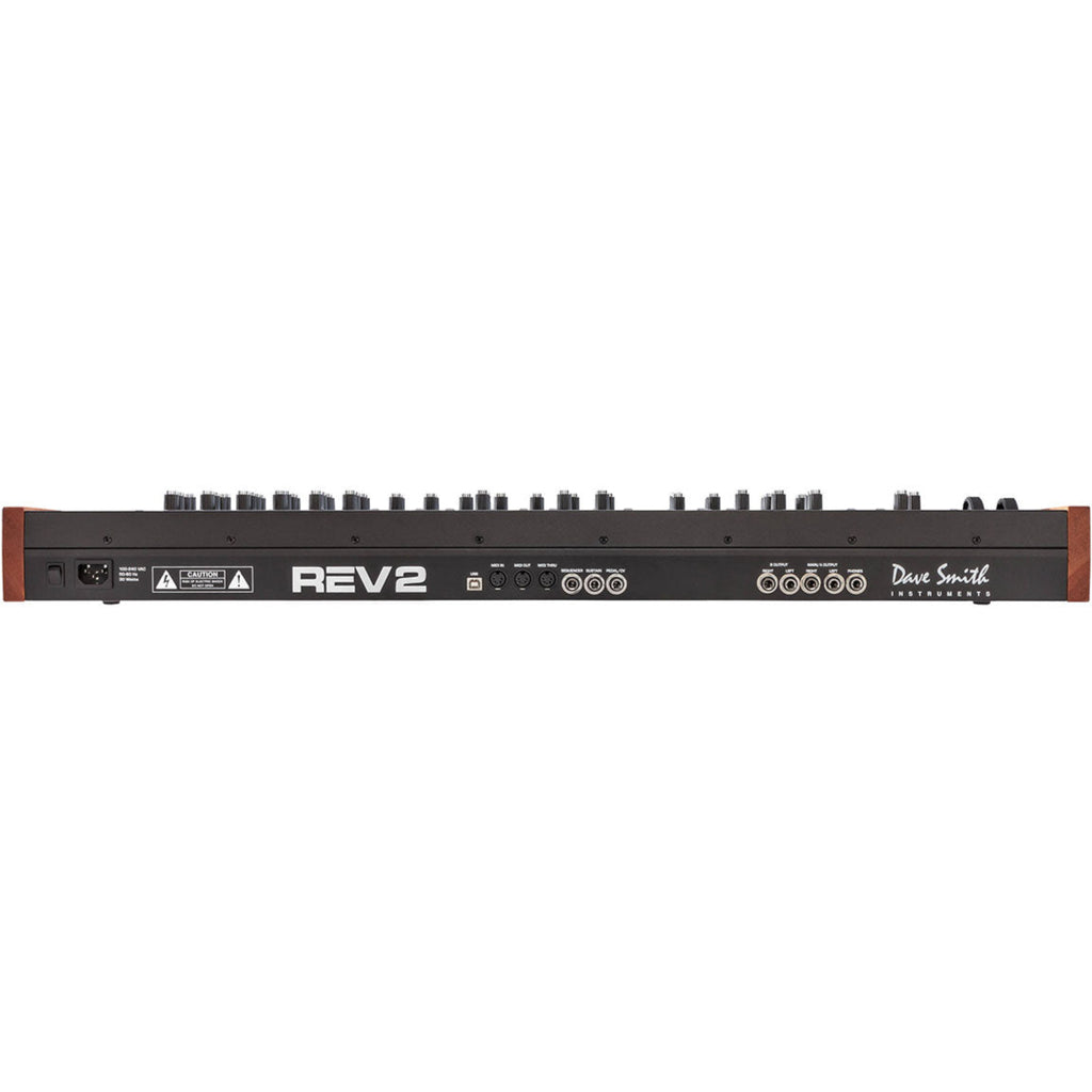 Sequential Prophet Rev2-16 synthesizer with 16-voice polyphony, featuring a sleek control panel and multiple knobs and buttons.