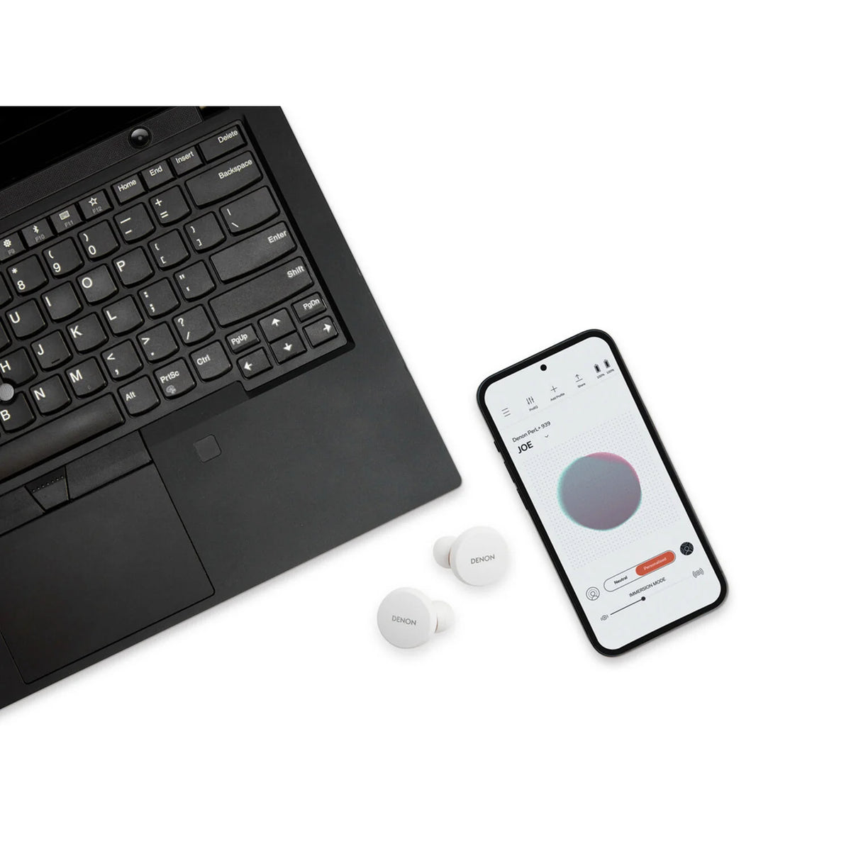 Denon PerL wireless in-ear headphones, lifestyle with companion app on laptop and phone
