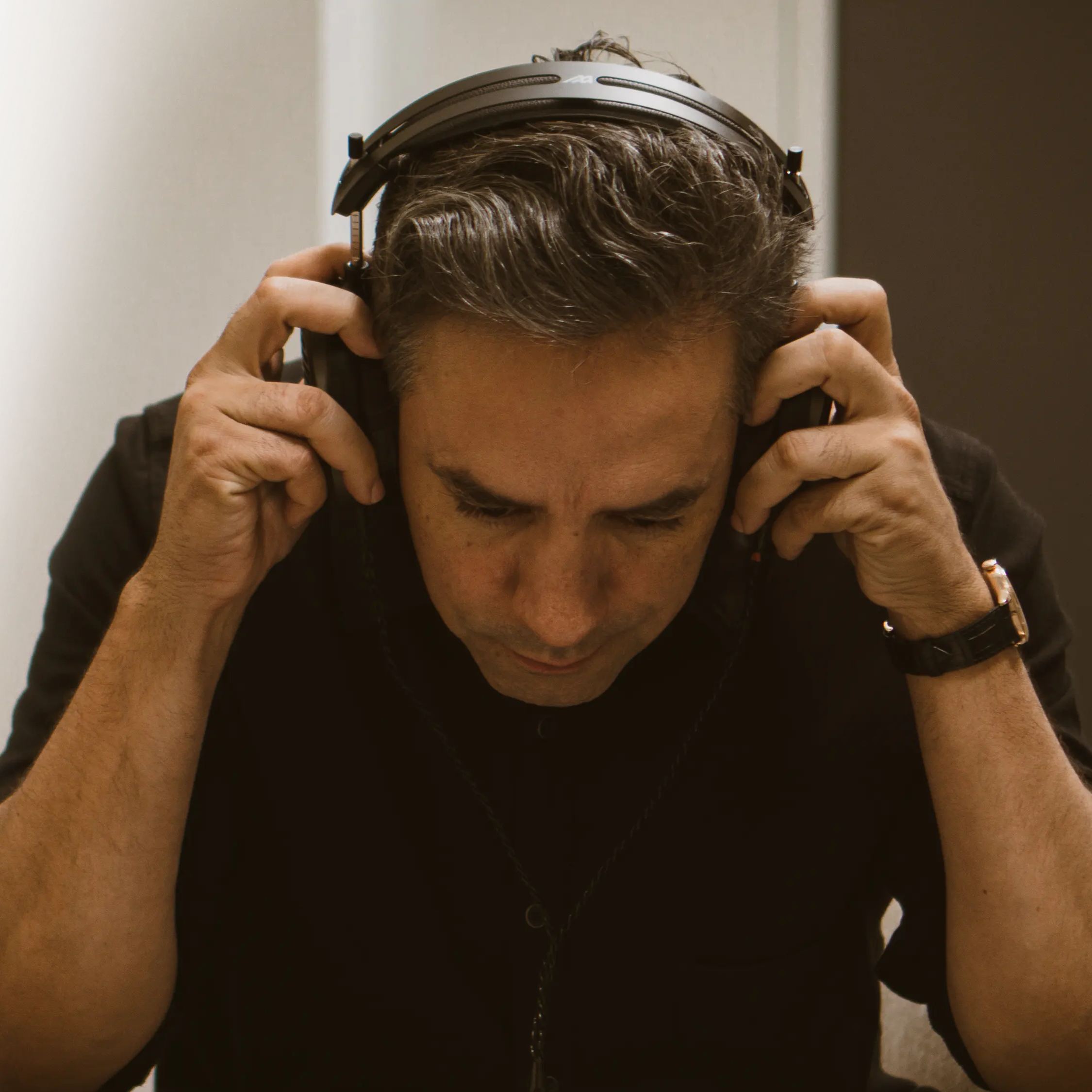 Audeze MM-500 studio headphones with over-ear design, black ear cups, and adjustable headband for professional audio monitoring.