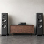 Eversolo AMP-F8 on a walnut sideboard between two floorstanding speakers