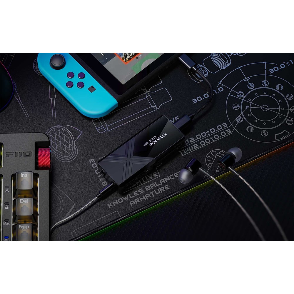 FiiO KA17 headphone amp / DAC, lifestyle connected to a handheld console