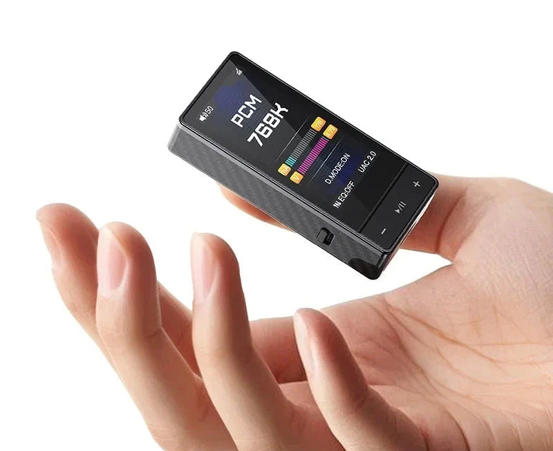 FiiO QX13 portable DAC and headphone amplifier with ES9027S Pro chip, compact design, and input/output ports.
