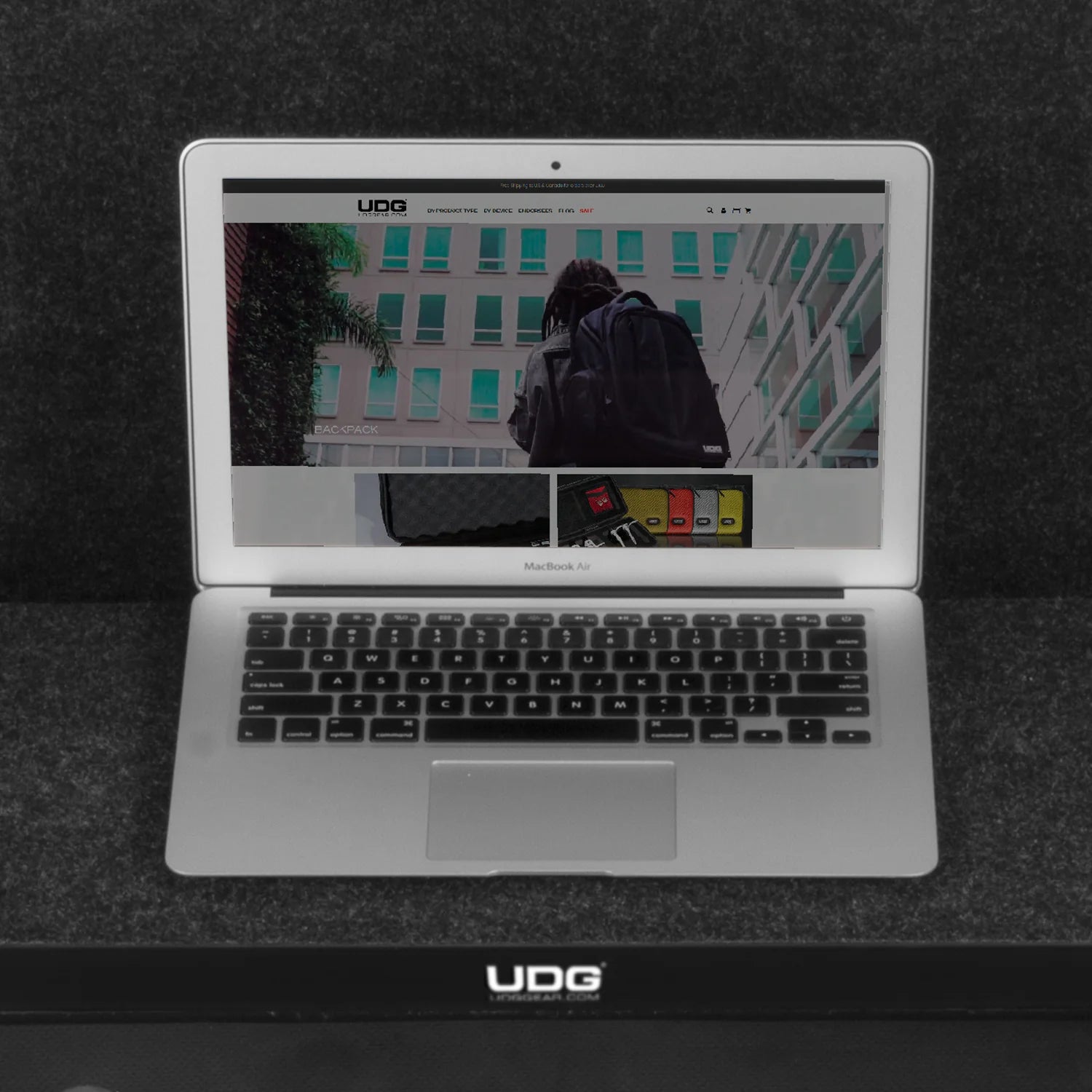 UDG Ultimate Flight Case AlphaTheta DDJ-GRV6 black DJ flight case with laptop shelf, durable protective design for DJ equipment.