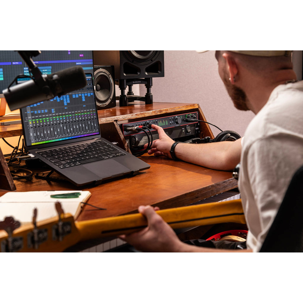Focusrite Scarlett 18i20 4th Gen audio interface, lifestyle in use with laptop