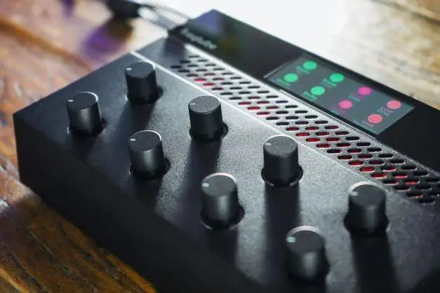 Freqport FreqTube FT1 effects and accessories device with controls and ports for audio processing and enhancement.