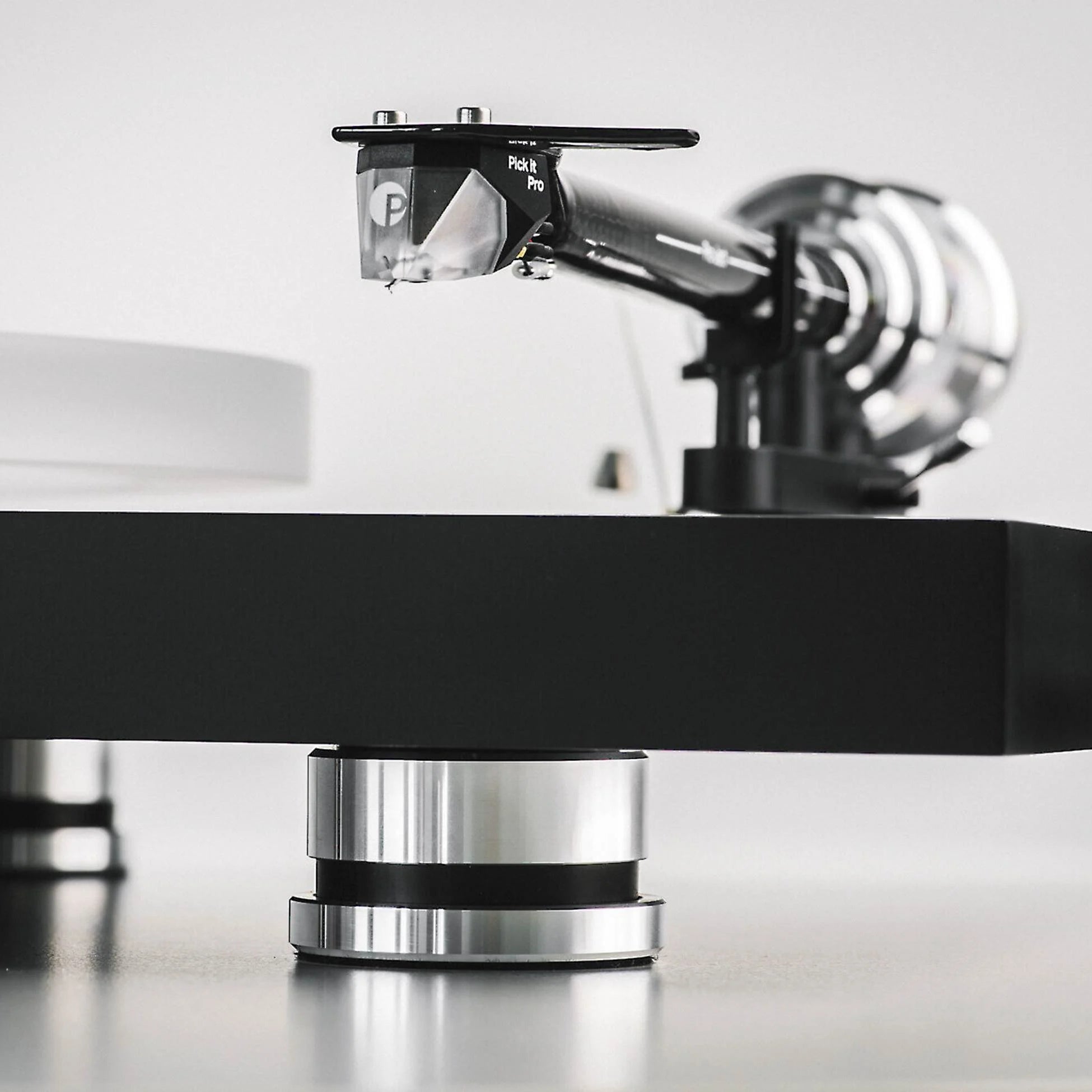 Pro-Ject Debut Reference 10 manual turntable with sleek design and tonearm, showcasing high-quality audio equipment.